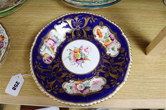 A small collection of decorative floral painted dessert dishes